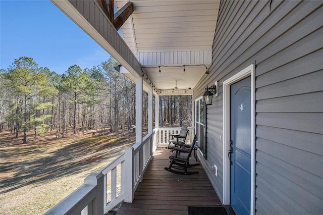 wooden deck featuring covered porch