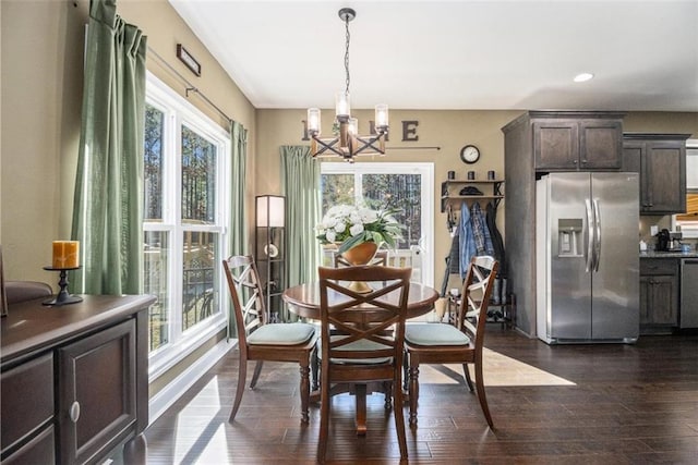 dining room featuring baseboards, dark wood-type flooring, recessed lighting, and a notable chandelier