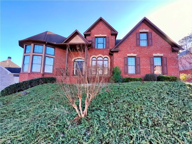 view of front of property featuring brick siding