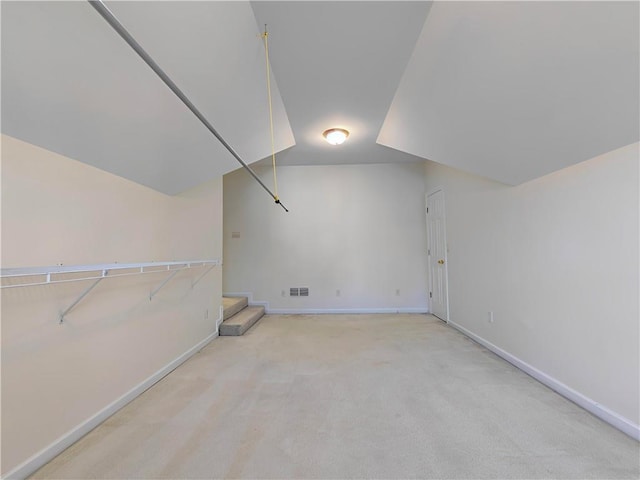 additional living space with stairs, carpet flooring, visible vents, and baseboards