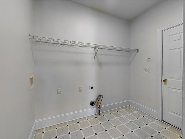 washroom featuring laundry area, washer hookup, baseboards, light floors, and electric dryer hookup