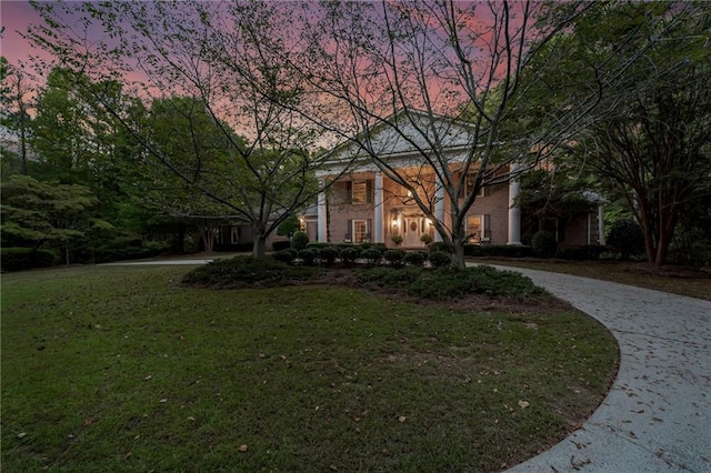 view of front of property with a lawn