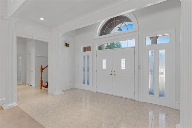 3030 Berry Rd, Loganville, GA 30052 - foyer featuring decorative columns, crown molding, stairway, and recessed lighting