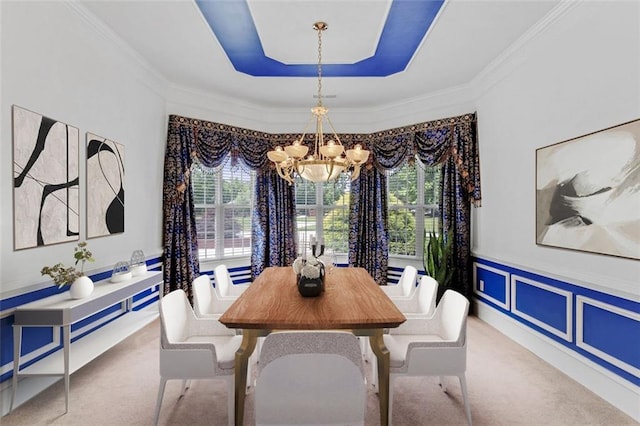 3030 Berry Rd, Loganville, GA 30052 - dining area with carpet, a chandelier, healthy amount of natural light, a tray ceiling, and crown molding