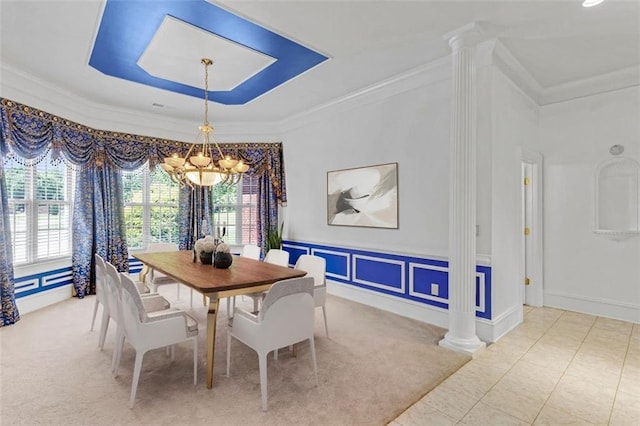 3030 Berry Rd, Loganville, GA 30052 - dining space featuring a chandelier, healthy amount of natural light, a raised ceiling, ornamental molding, and decorative columns