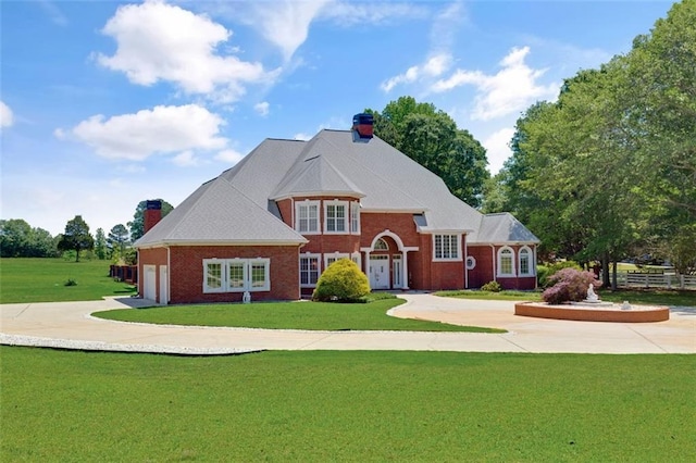 3030 Berry Rd, Loganville, GA 30052 - view of front of home featuring a chimney, driveway, a front yard, and a garage