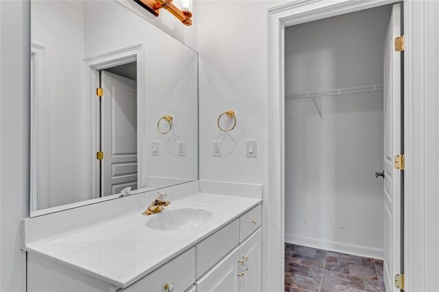 3030 Berry Rd, Loganville, GA 30052 - bathroom with stone finish flooring, vanity, and baseboards