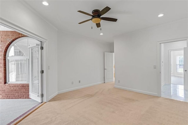 3030 Berry Rd, Loganville, GA 30052 - spare room featuring light colored carpet, ceiling fan, crown molding, baseboards, and recessed lighting