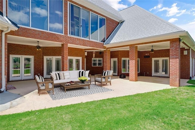 3030 Berry Rd, Loganville, GA 30052 - rear view of house with french doors, a ceiling fan, brick siding, a yard, and outdoor lounge area