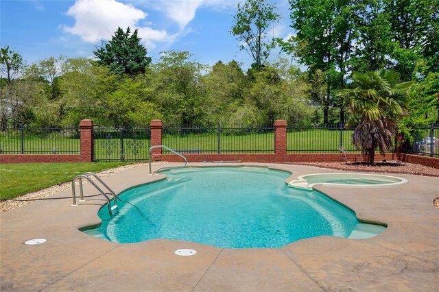 3030 Berry Rd, Loganville, GA 30052 - view of swimming pool with a patio, view of scattered trees, and a pool with connected hot tub