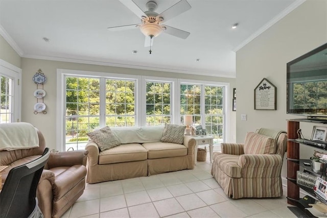 living room with ceiling fan, a wealth of natural light, ornamental molding, and light tile floors