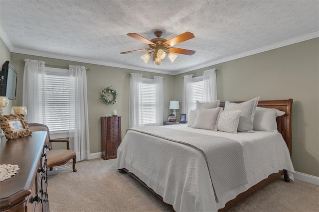 carpeted bedroom featuring ornamental molding, ceiling fan, and a textured ceiling