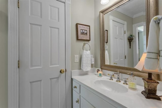 bathroom featuring ornamental molding and vanity