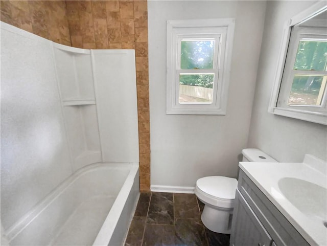 full bathroom featuring shower / bathing tub combination, vanity, toilet, and baseboards