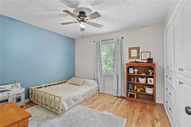 250 Vermont St, Demorest, GA 30535 - bedroom with light wood finished floors, baseboards, and a textured ceiling