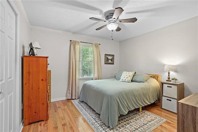 250 Vermont St, Demorest, GA 30535 - bedroom with light wood finished floors, a ceiling fan, a textured ceiling, and baseboards