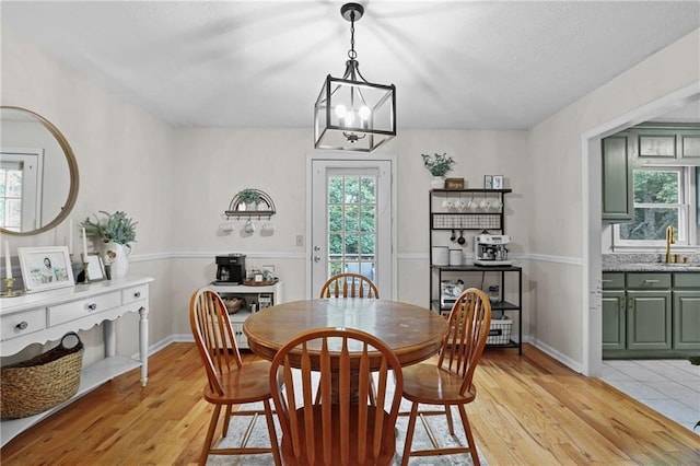 250 Vermont St, Demorest, GA 30535 - dining room with light wood-type flooring, healthy amount of natural light, and a chandelier