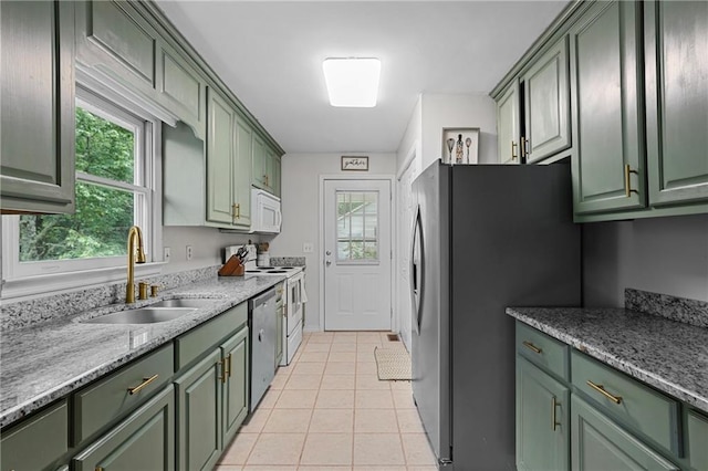250 Vermont St, Demorest, GA 30535 - kitchen featuring green cabinetry, a sink, stainless steel appliances, light tile patterned flooring, and light stone countertops
