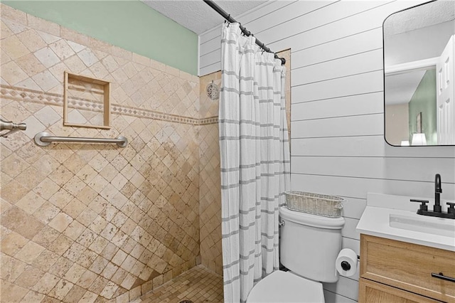 250 Vermont St, Demorest, GA 30535 - full bath with vanity, toilet, tiled shower, and a textured ceiling