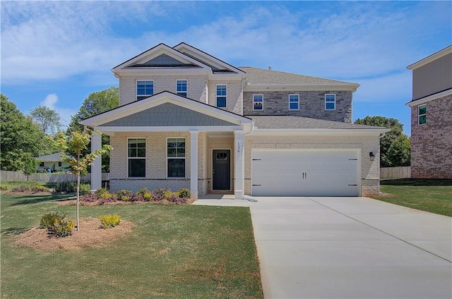 craftsman-style home featuring a garage, brick siding, and driveway