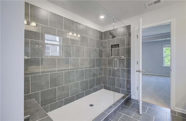 full bath featuring tile patterned flooring, baseboards, a shower stall, and recessed lighting