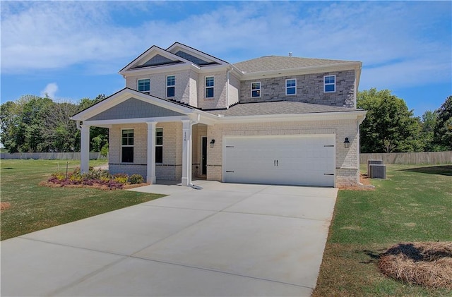 craftsman house featuring a porch, central air condition unit, brick siding, concrete driveway, and a garage