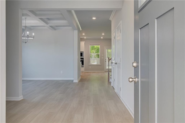 hallway featuring light wood-style floors, beam ceiling, a chandelier, baseboards, and recessed lighting