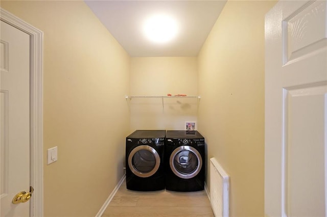 2747 Harper Woods Dr, Marietta, GA 30062 - laundry room with independent washer and dryer, radiator, wood finished floors, and baseboards