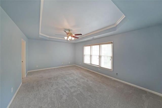 2747 Harper Woods Dr, Marietta, GA 30062 - empty room featuring a raised ceiling, a ceiling fan, carpet flooring, and baseboards