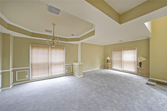 2747 Harper Woods Dr, Marietta, GA 30062 - spare room featuring a chandelier, a raised ceiling, carpet flooring, crown molding, and baseboards