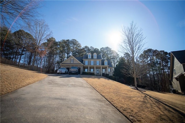 view of front of home with a garage and a front lawn