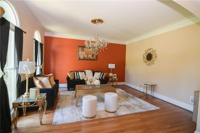 interior space featuring an inviting chandelier, hardwood / wood-style floors, and ornamental molding