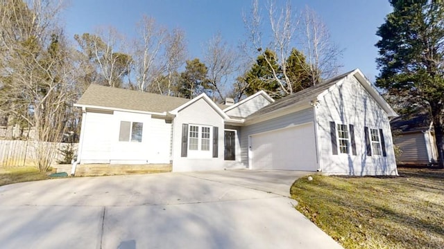 ranch-style home with a garage and a front yard