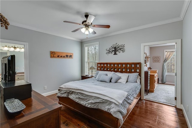 bedroom featuring crown molding, ceiling fan, dark hardwood / wood-style flooring, and ensuite bath