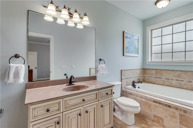 bathroom with ornamental molding, vanity, toilet, tiled tub, and tile patterned floors