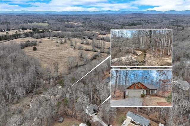 drone / aerial view featuring a mountain view