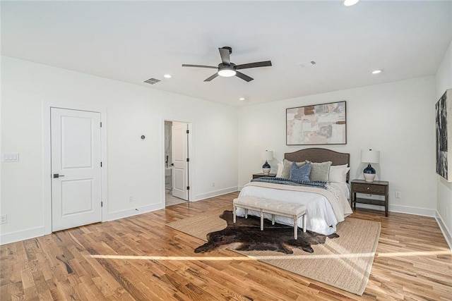 bedroom with ceiling fan and light hardwood / wood-style floors