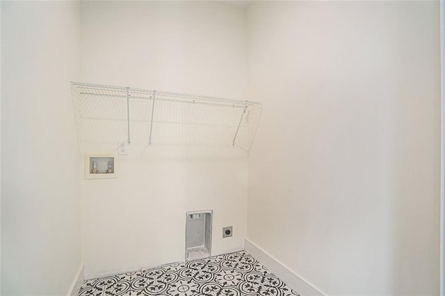 laundry area with hookup for a washing machine, electric dryer hookup, and light tile patterned floors