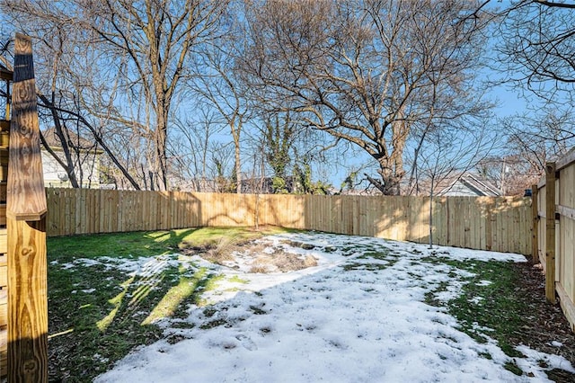 view of yard layered in snow