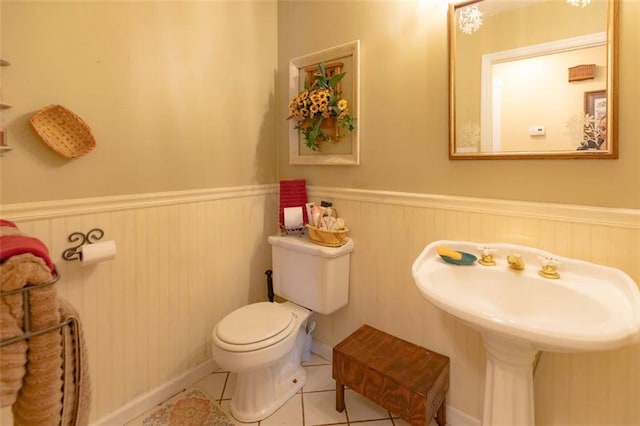 bathroom with tile patterned floors and toilet