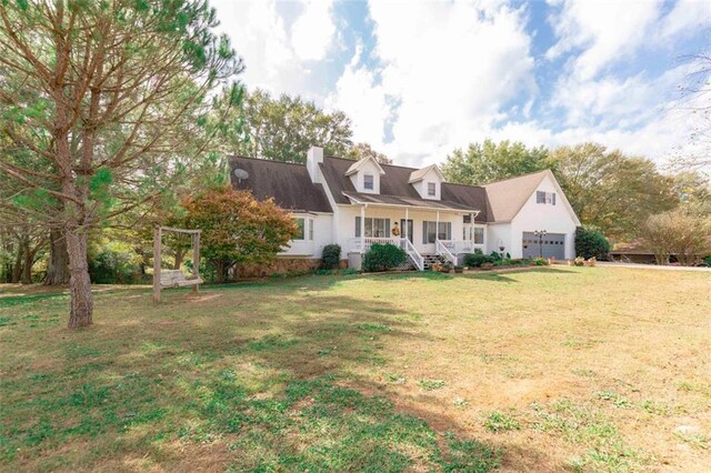 cape cod-style house with a porch and a front lawn