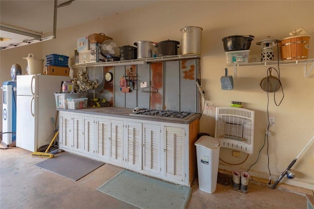 interior space featuring concrete floors and heating unit