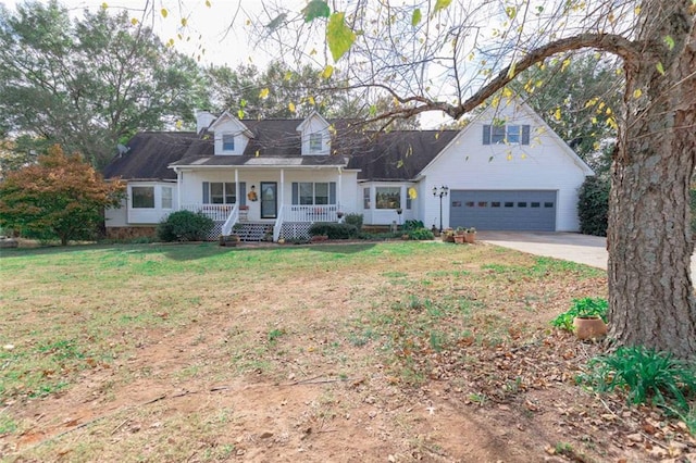 new england style home featuring a garage, covered porch, and a front yard