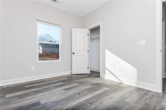 unfurnished bedroom featuring hardwood / wood-style flooring