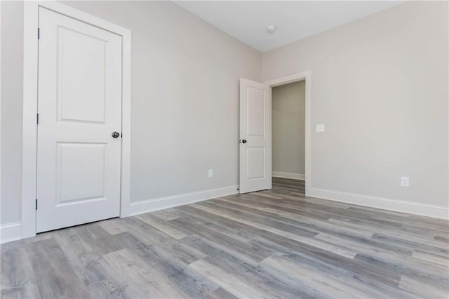 spare room featuring light hardwood / wood-style floors