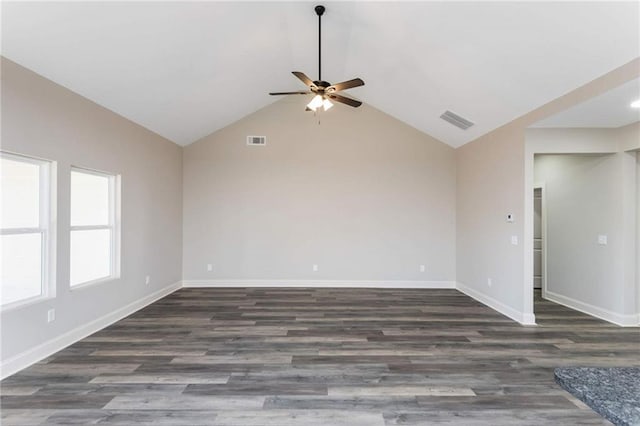 unfurnished room with dark hardwood / wood-style flooring, lofted ceiling, and ceiling fan