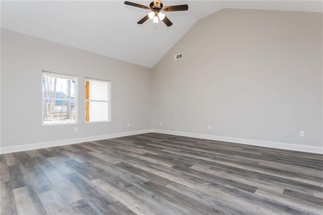 empty room featuring dark wood-type flooring, ceiling fan, and high vaulted ceiling