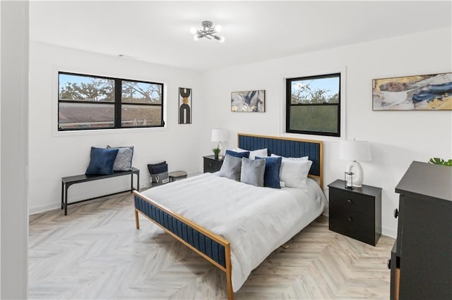 1066 Cleavemark Dr, Clarkston, GA 30021 - bedroom with baseboards and a chandelier