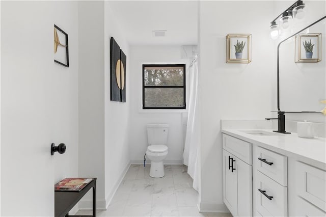 1066 Cleavemark Dr, Clarkston, GA 30021 - full bath featuring marble look tile flooring, toilet, vanity, and baseboards