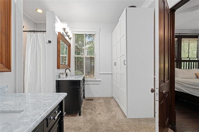 161 N Barton St, Norcross, GA 30071 - ensuite bathroom featuring crown molding, two vanities, a wainscoted wall, and recessed lighting